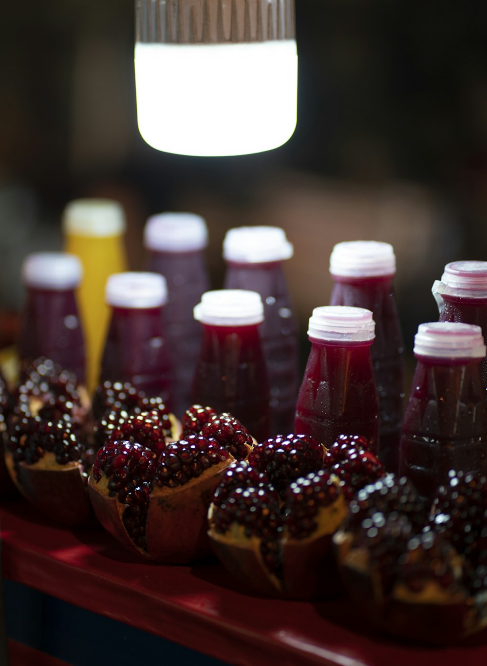 pomegranate pie near juice bottles