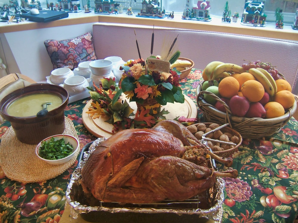 roasted chicken beside basket of fruits