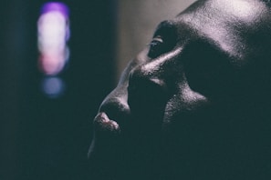 Close-up of a patient receiving a facial treatment with gentle lighting highlighting skin texture