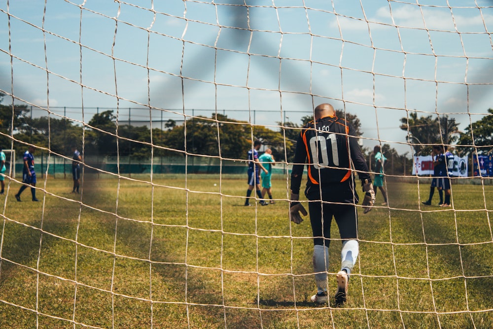 man facing back on brown net