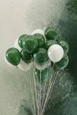 Elegant balloon centerpiece featuring soft pink and mint green spheres.