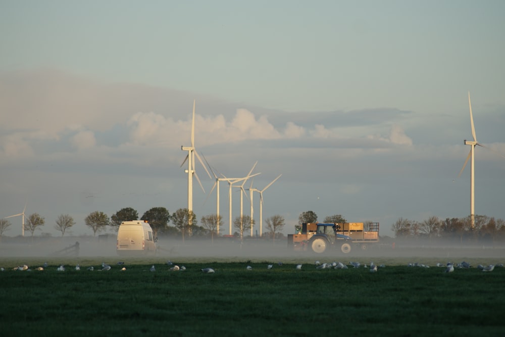 white wind turbines during daytime