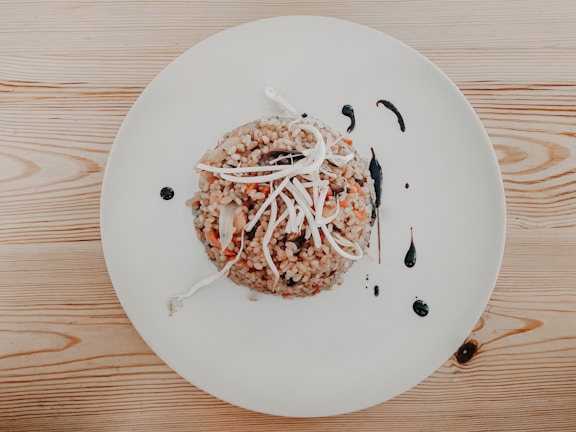 Polished, steaming bowls of white rice served elegantly on a minimalist navy-blue plate.