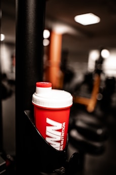 red and white plastic tumbler