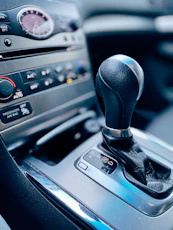 black and silver car gear shift lever