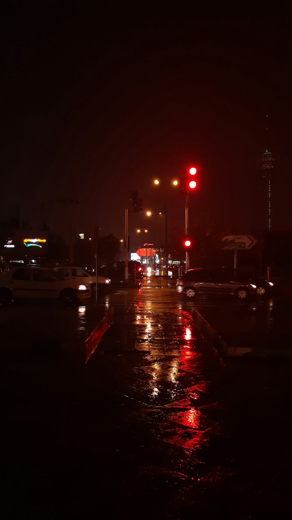 traffic light with red lights during nighttime