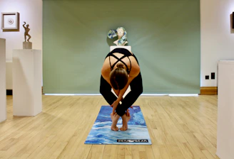 Instructor Balamuraleekrishnan guiding a yoga therapy session in a serene Chennai studio.