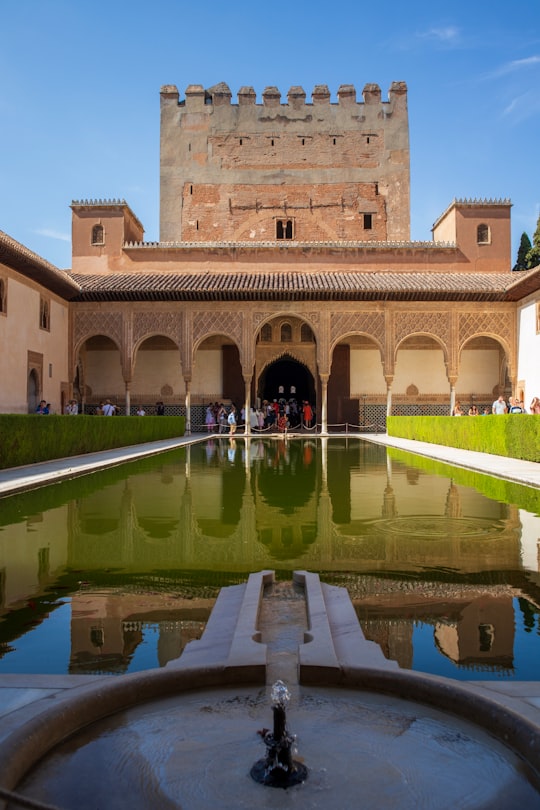 brown concrete building during daytime in Alhambra Palace Spain