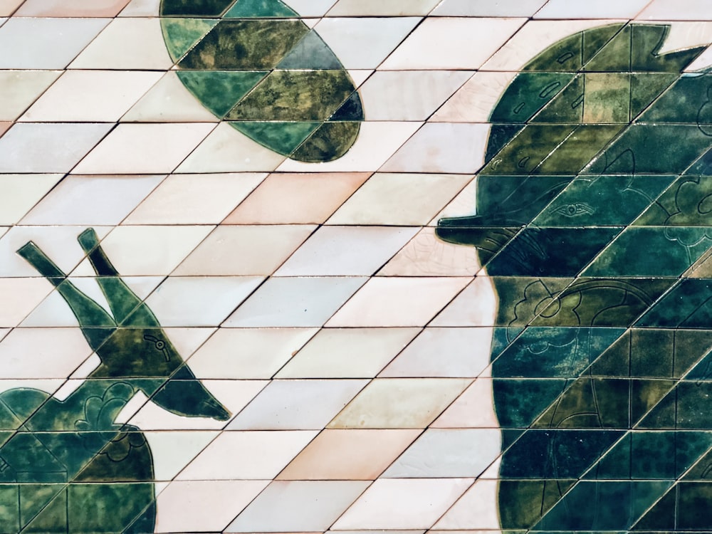 a close up of a tiled wall with a silhouette of a person holding an umbrella