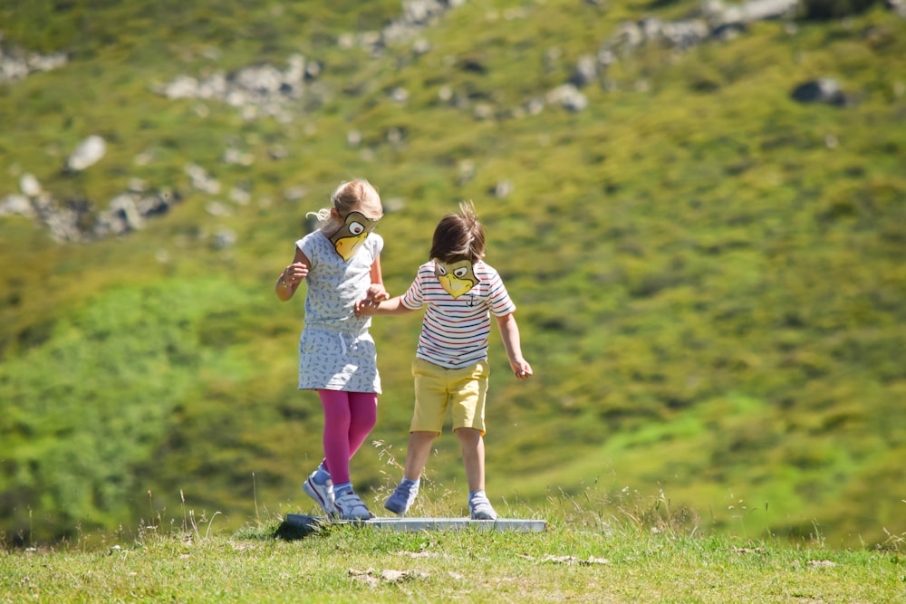 two toddlers playing outdoors