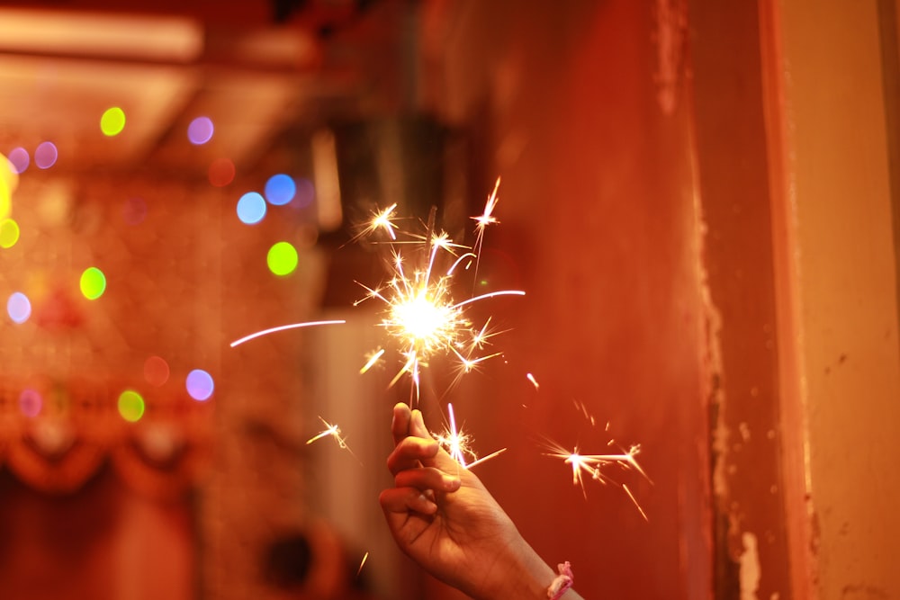 person holding firecrackers