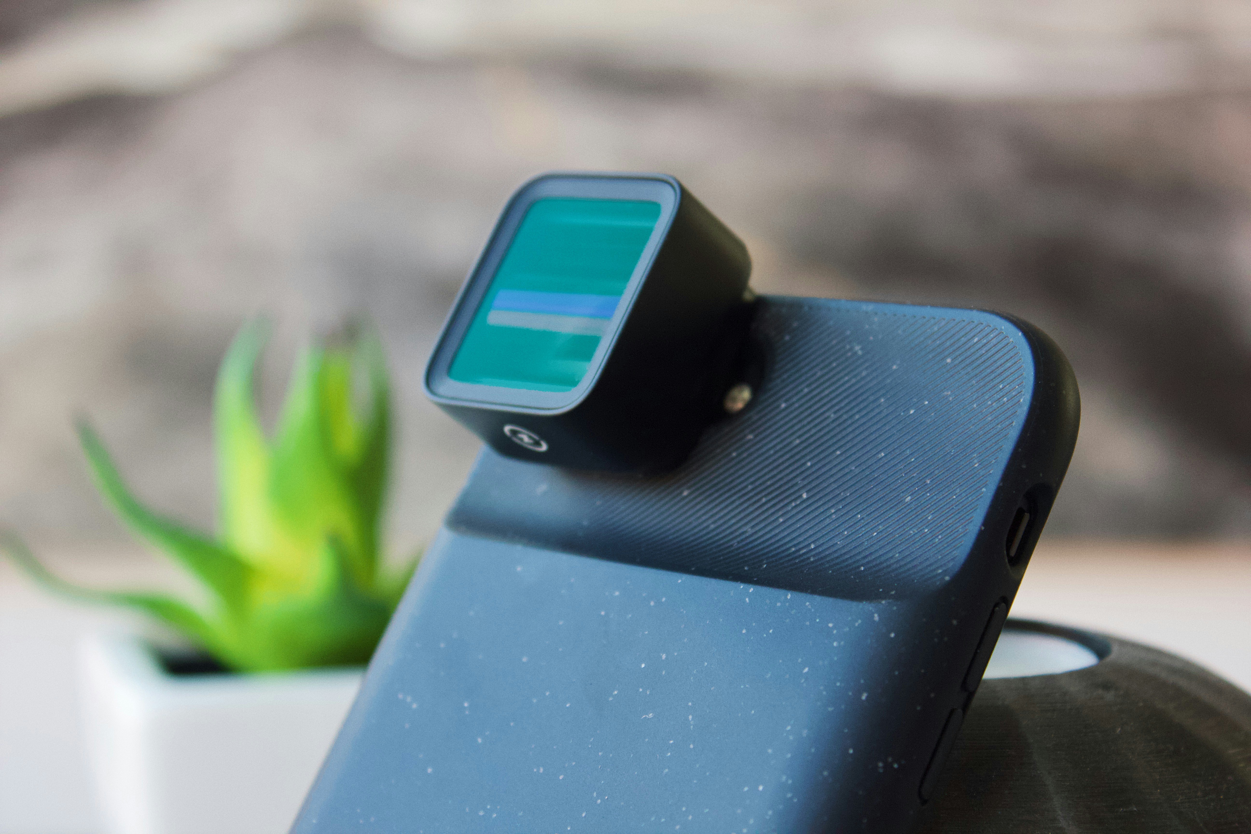 Black smartphone with camera enhancer accessory photo Free Iphone