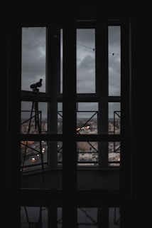 A cozy workspace with a telescope pointing towards the stars at dusk.