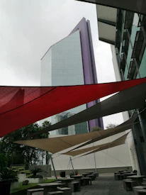 Close-up of innovative tensile fabric stretched over a modern building facade.