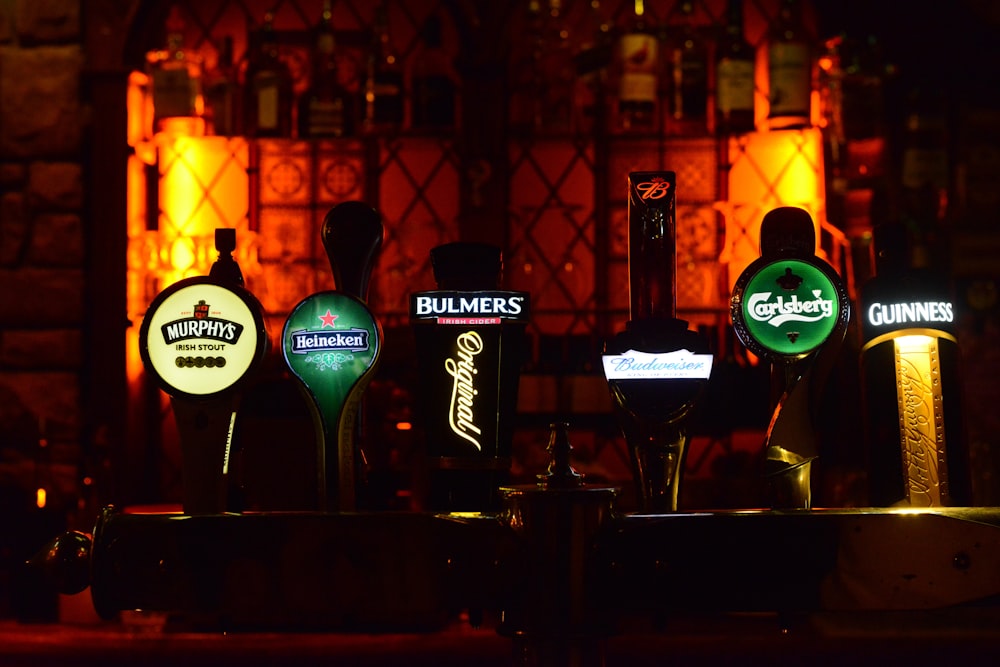 several assorted color and brand beer tap machines