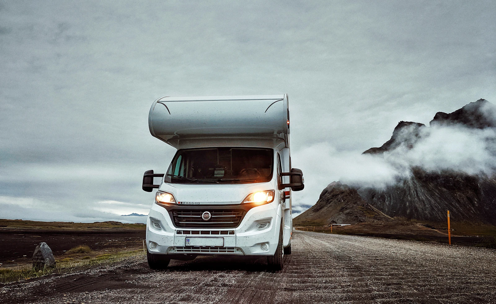 A motorhome traveling on an established Icelandic road