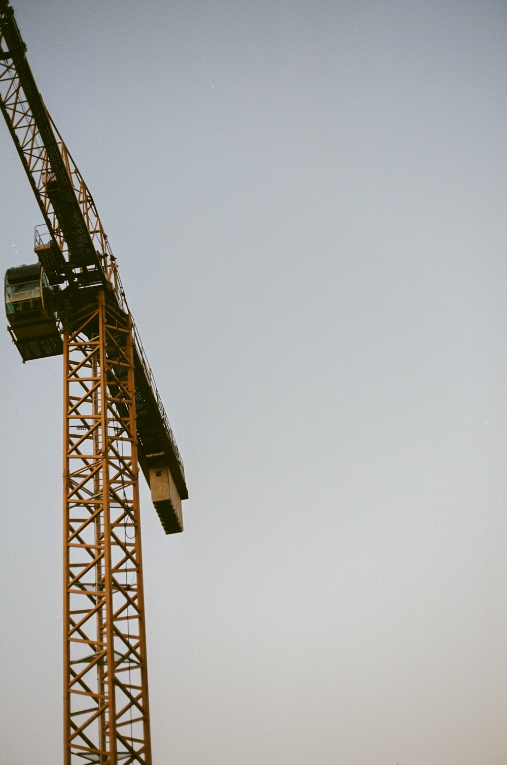 yellow and brown crane tower