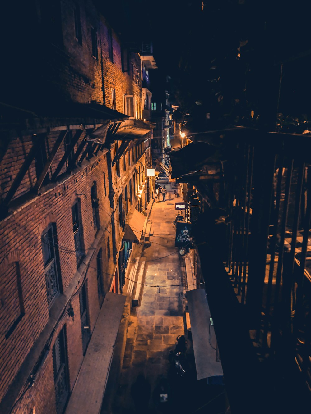 sidewalk of a building during nighttime