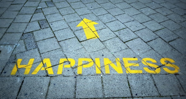Happiness sign painted on the pavement