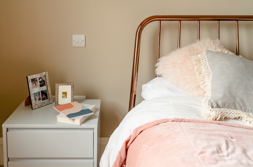 minimalist photography of a nightstand beside bed