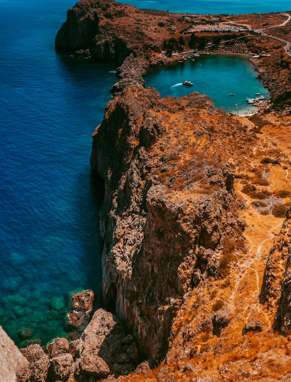 aerial photograph of lagoon on cliff