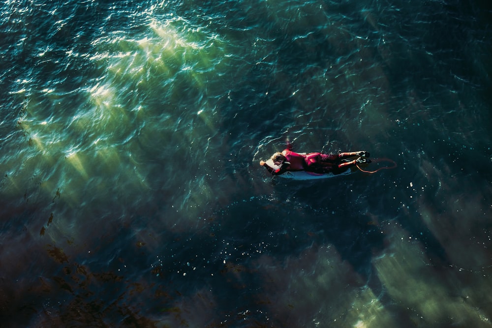 man riding paddleboard