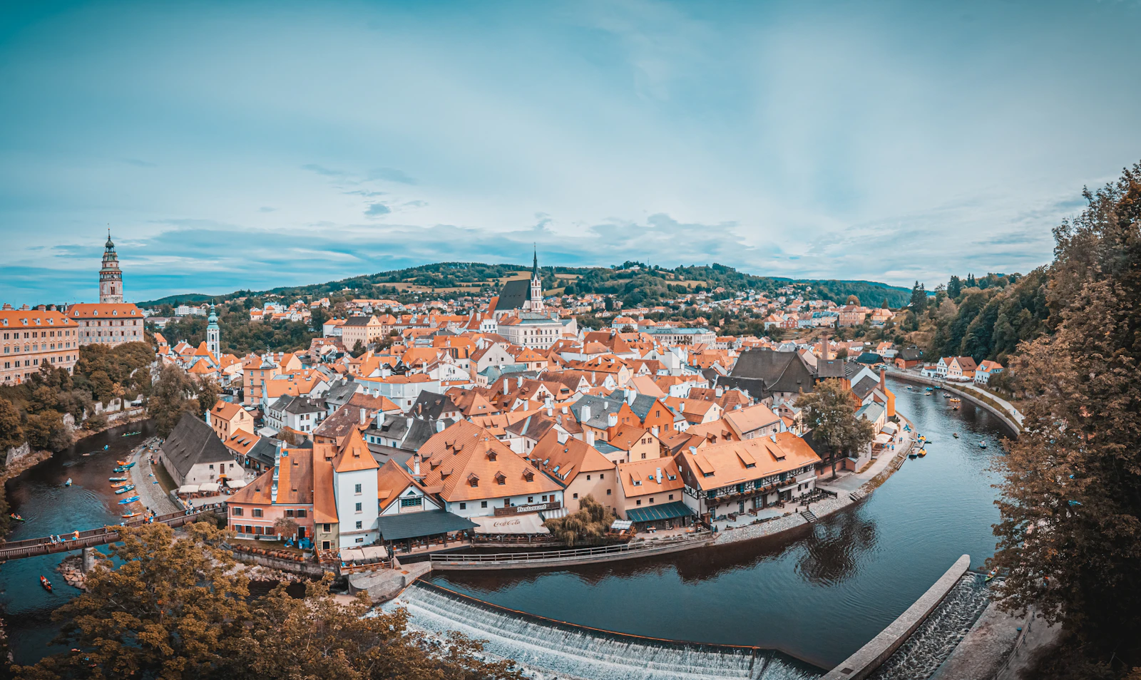 Aerial view of Český Krumlov, red-tiled rooftops and the Vltava River bending through the old town