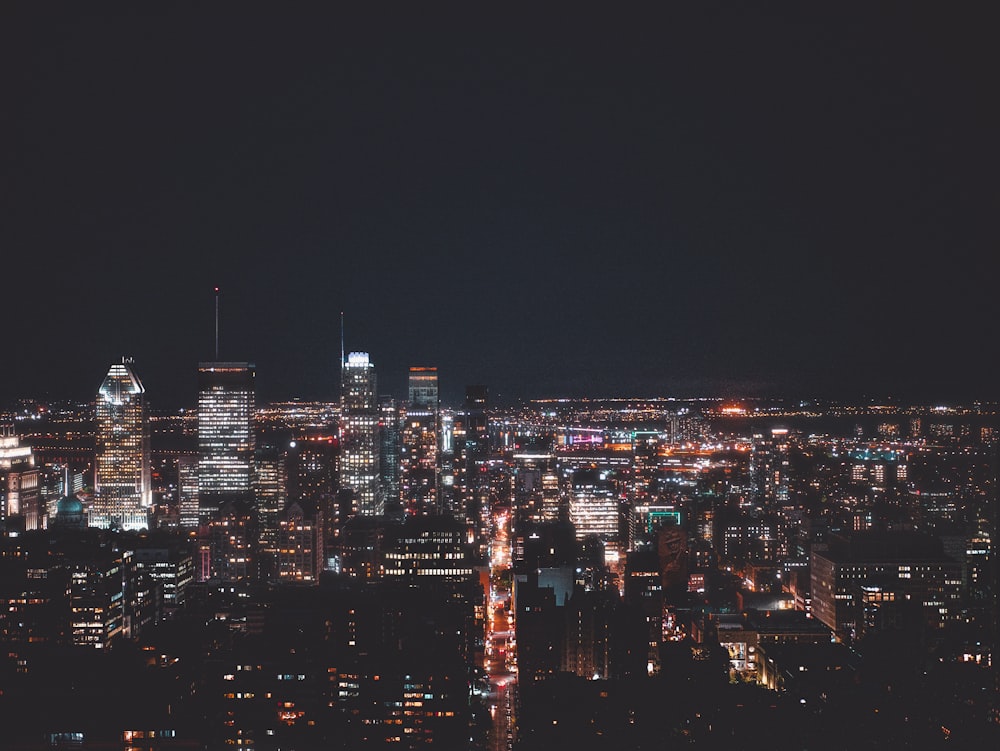 aerial photograph of city-high rise buildings at night