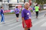 man in purple and white printed crew-neck t-shirt
