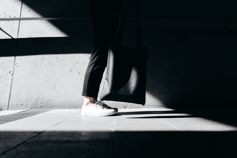 person wearing white sneakers