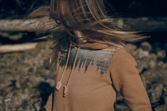 A close-up of a premium hoodie featuring intricate digital art inspired by nature.