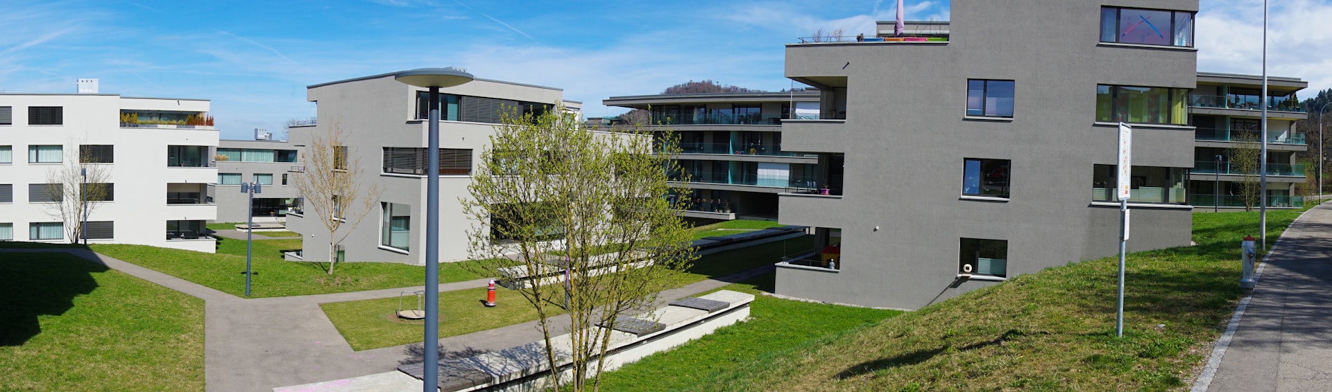 woman wearing yellow long-sleeved dress under white clouds and blue sky during daytime