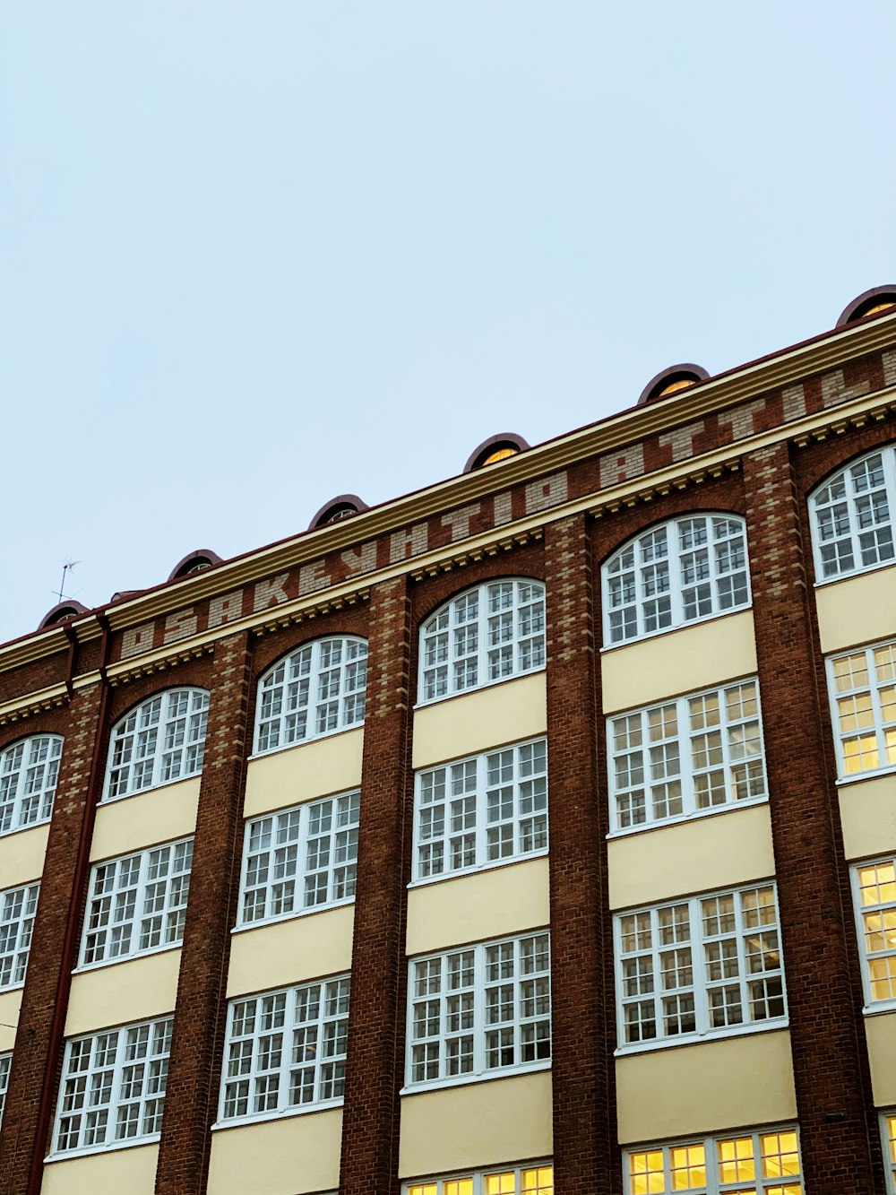 low angle photo of brown and white concrete buildings