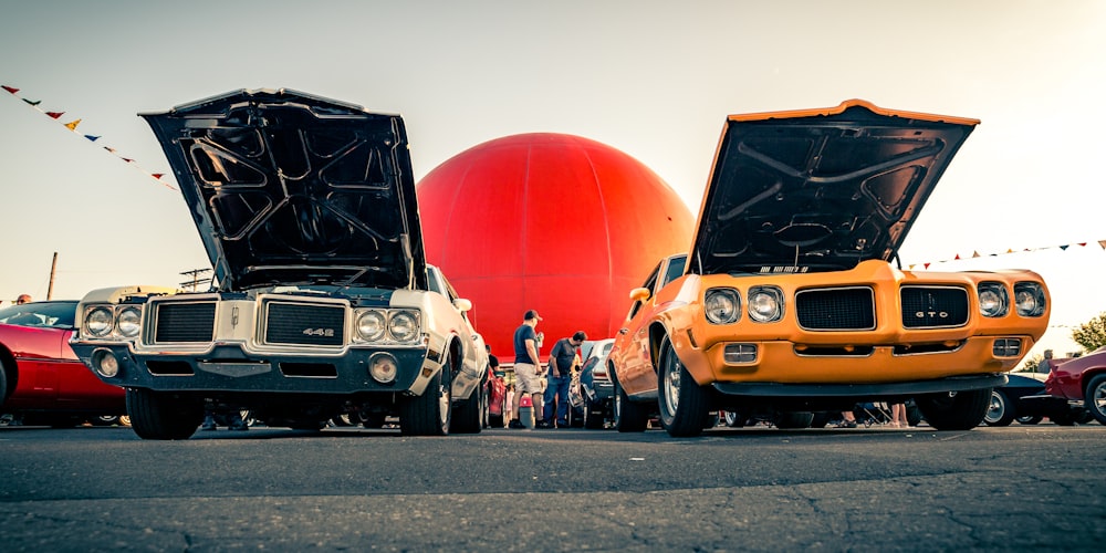 photo of teal and yellow classic vehicles