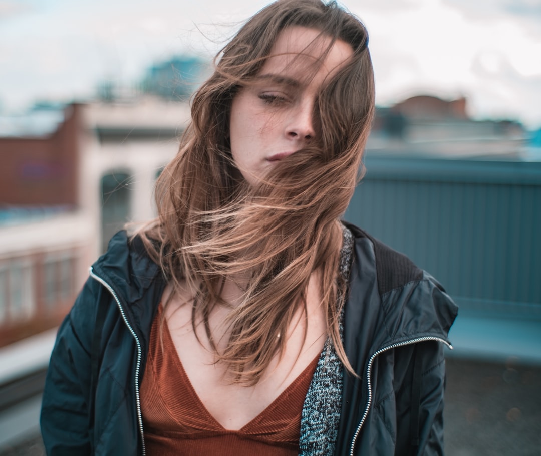 woman wearing blue zip-up jacket