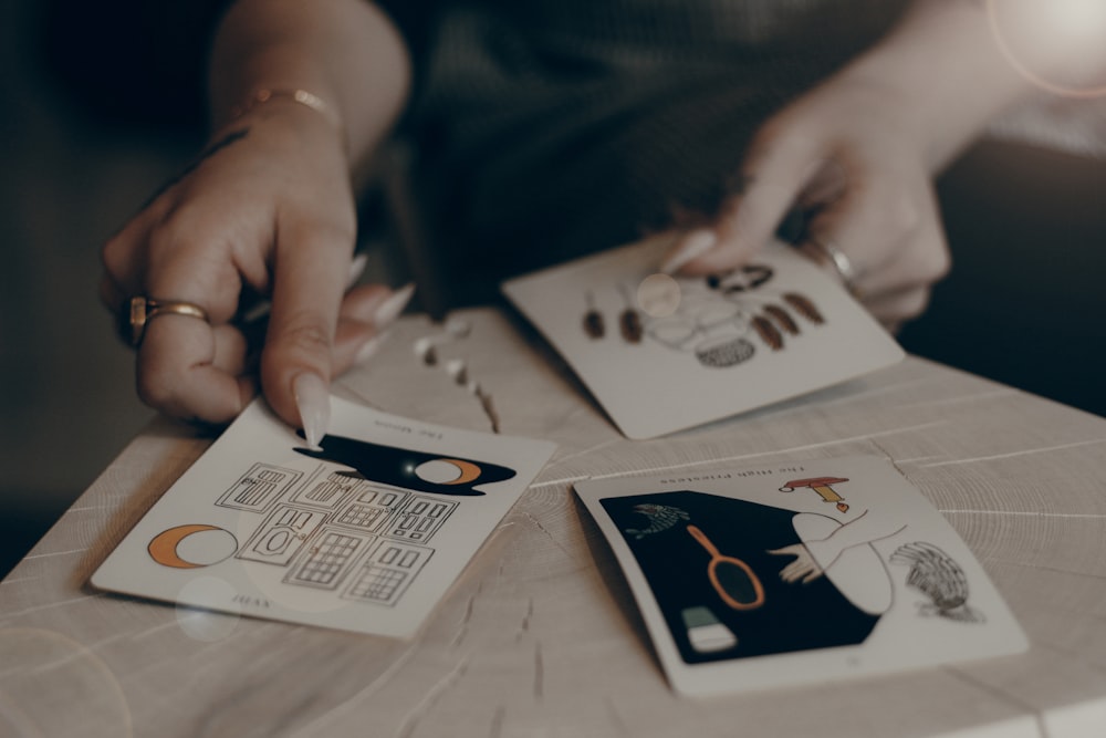 person holding cards