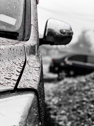 Water droplets on car being rinsed in self-serve