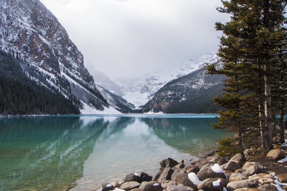 photo of icy mountain and lake scenery