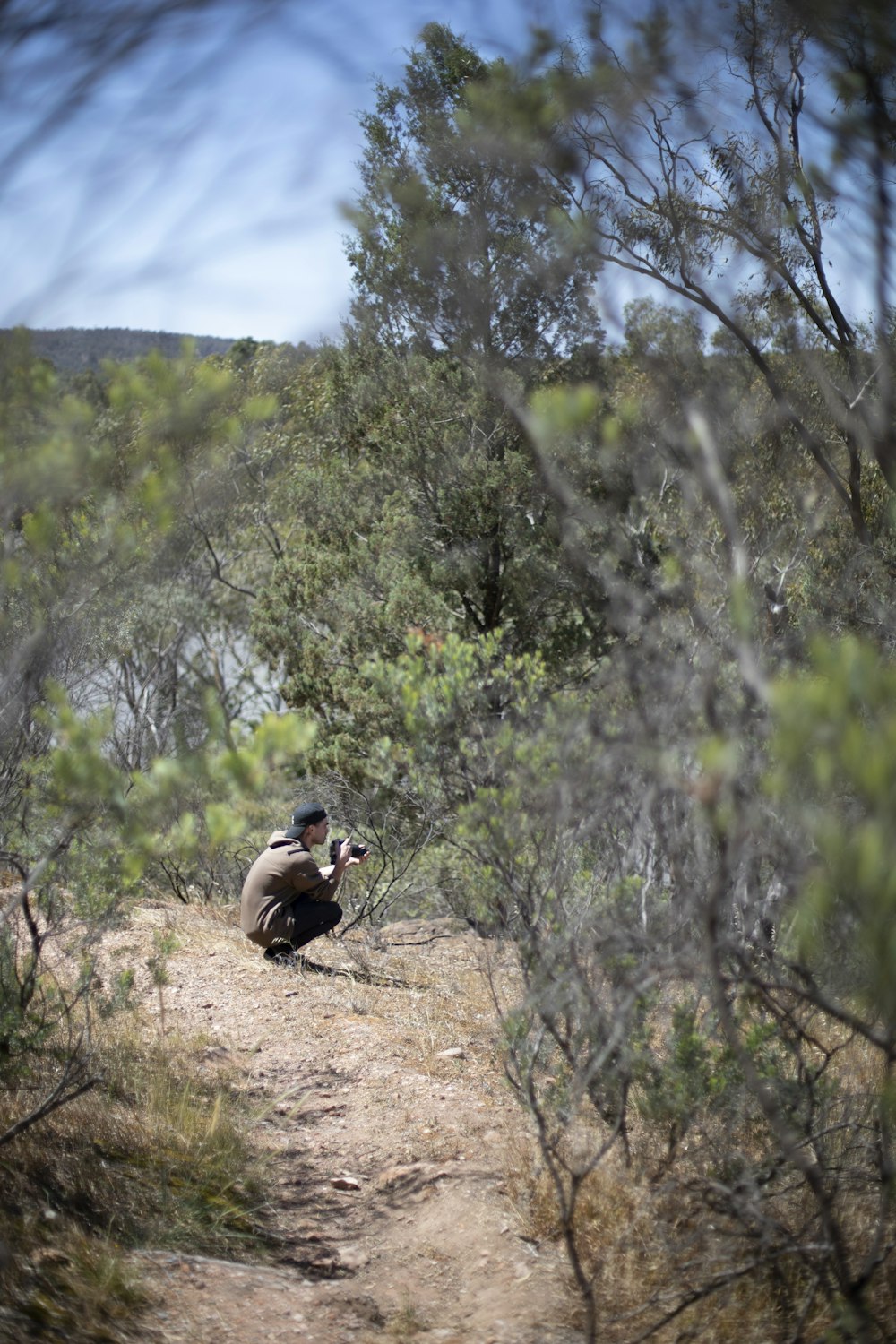 man sitting on cliff