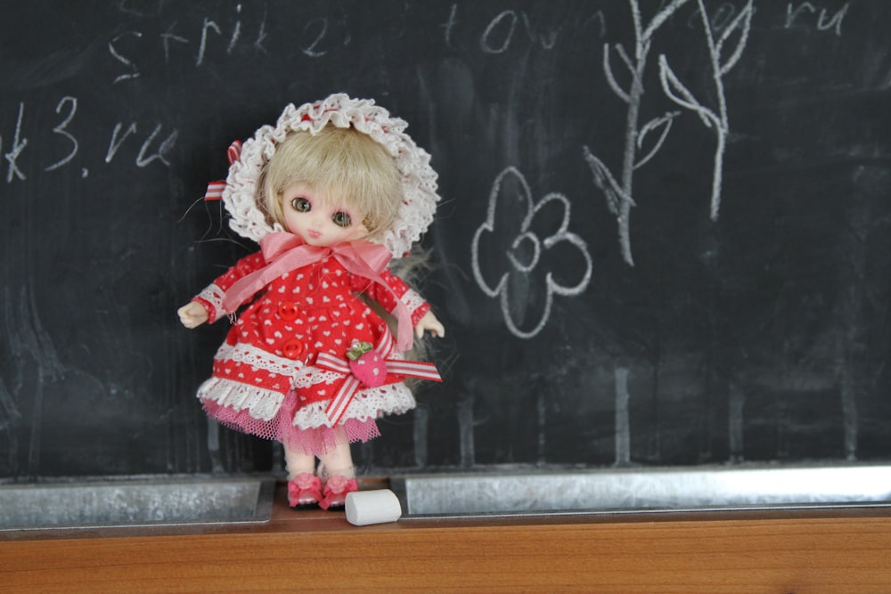 girl doll on chalkboard