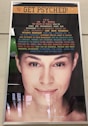 A poster features a close-up of a woman's face with a message about psychology. The top of the poster has the phrase 'GET PSYCHED!' in large orange text. Below, there is a series of questions in varying sizes and colors, exploring different psychological topics. The bottom part of the poster contains a web address.