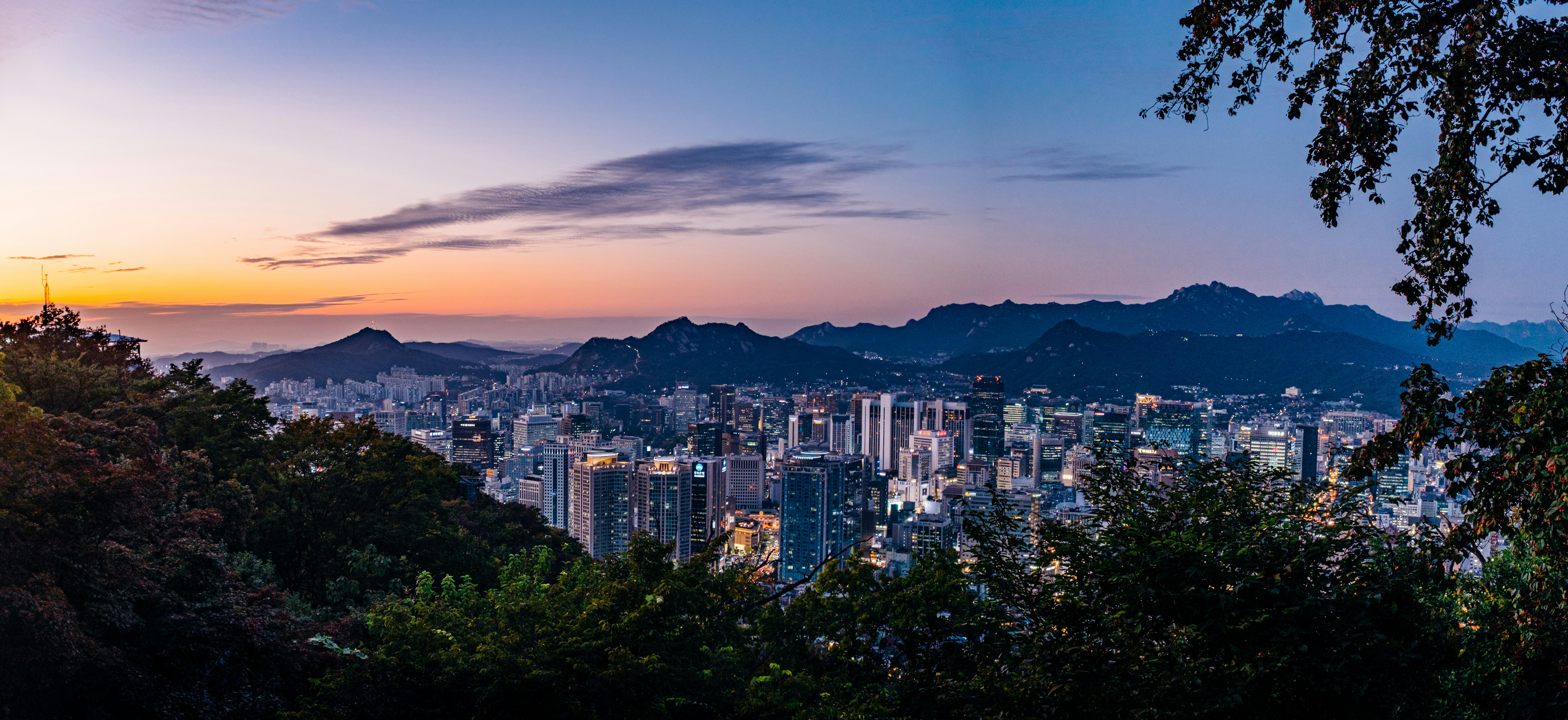metropolitan buildings near mountains