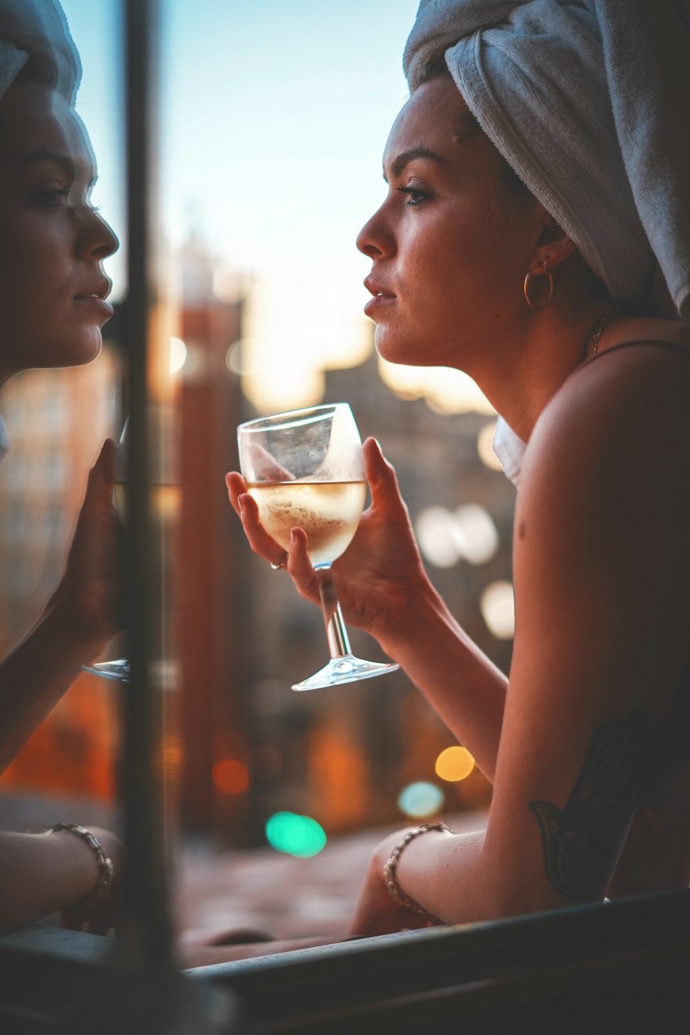 woman holding wine glass facing sideways