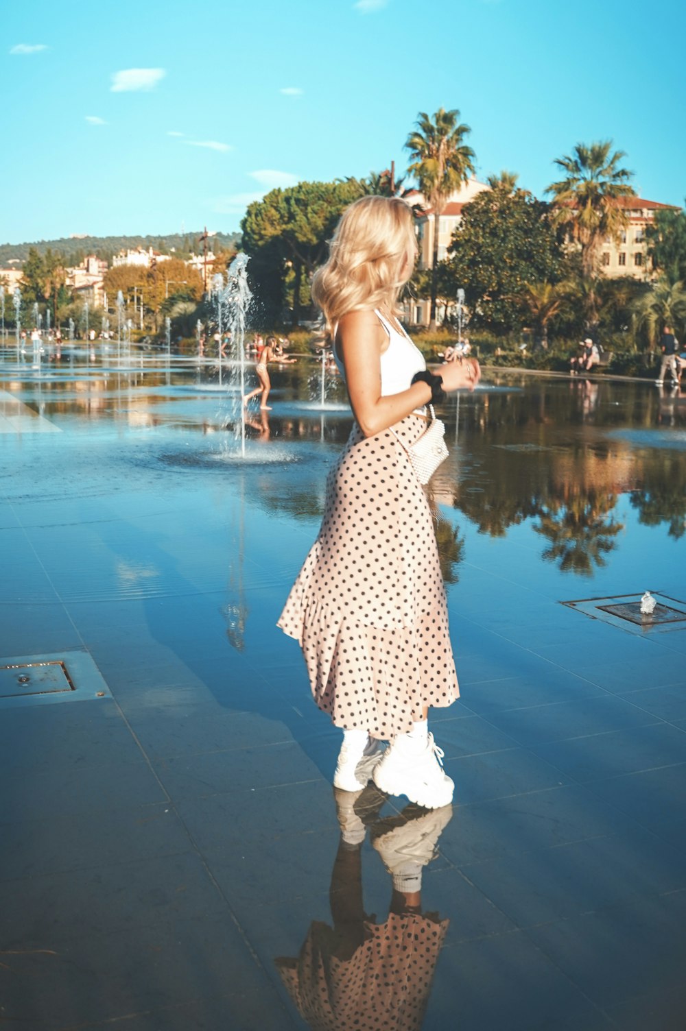 woman standing near trees