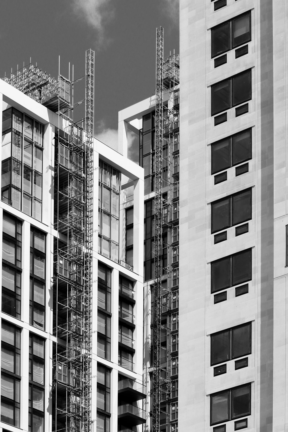 grayscale photography of high-rise buildings