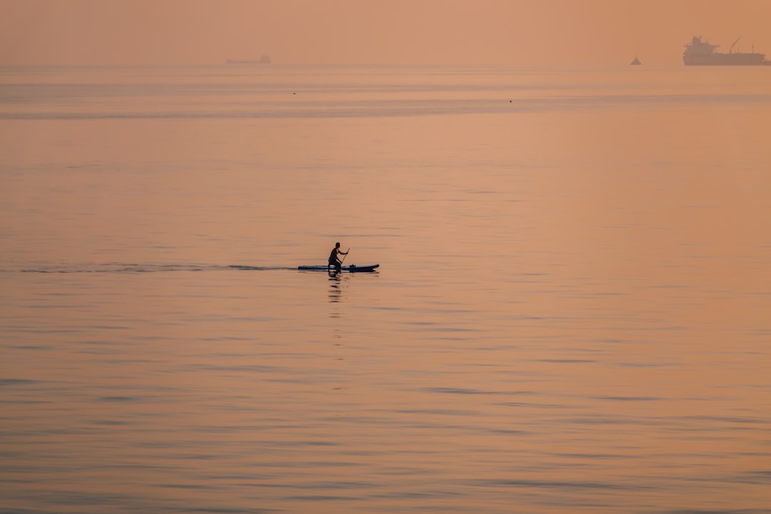 person paddling during golden hour