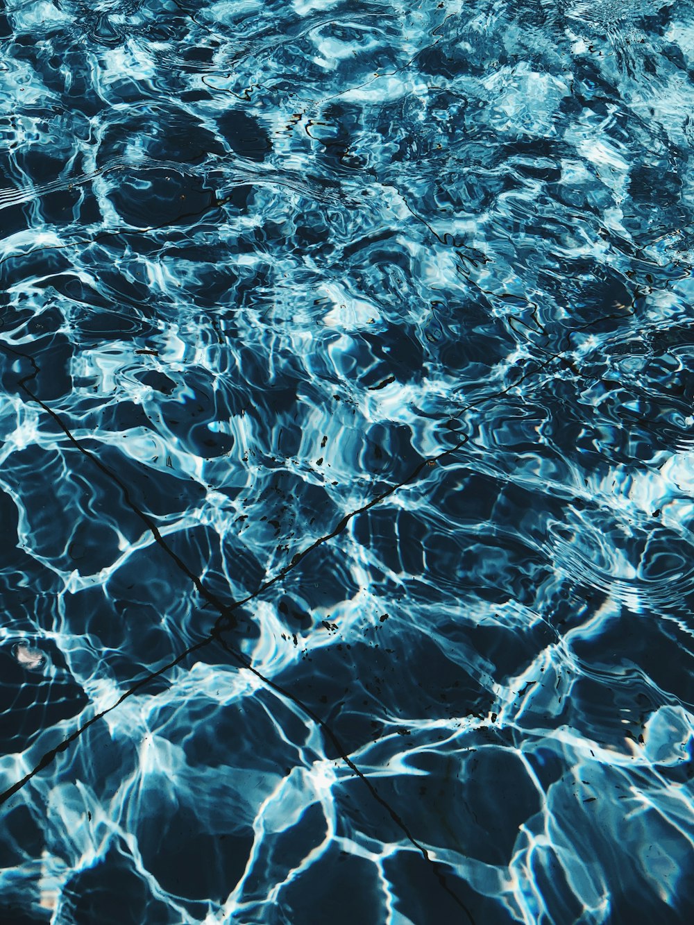 time lapse photography of rippling crystal blue water