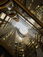 A panoramic view of the Aurea Terra Inc. headquarters lobby with futuristic design elements and ambient lighting.