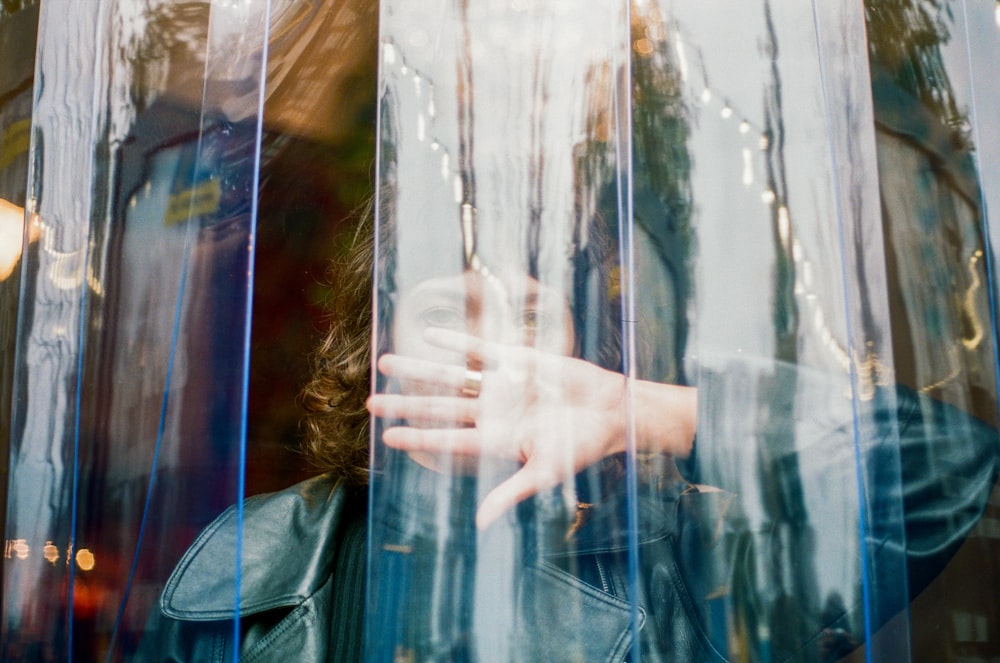 person inside clear plastic curtain