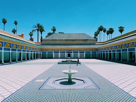 person walking near Marrakech building during daytime